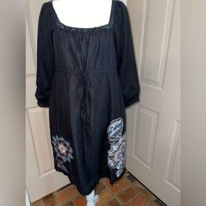 Lulumari drawstring empire waist dress with embroidered floral appliqués.